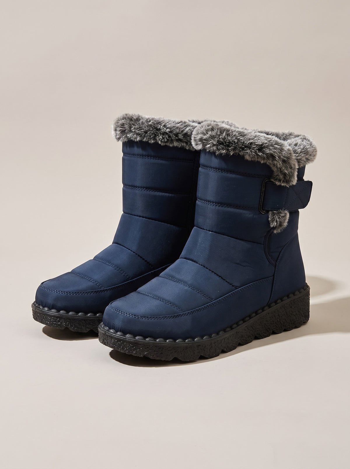 TEAGAN Quilted Faux Fur Snow Boots in blue, front