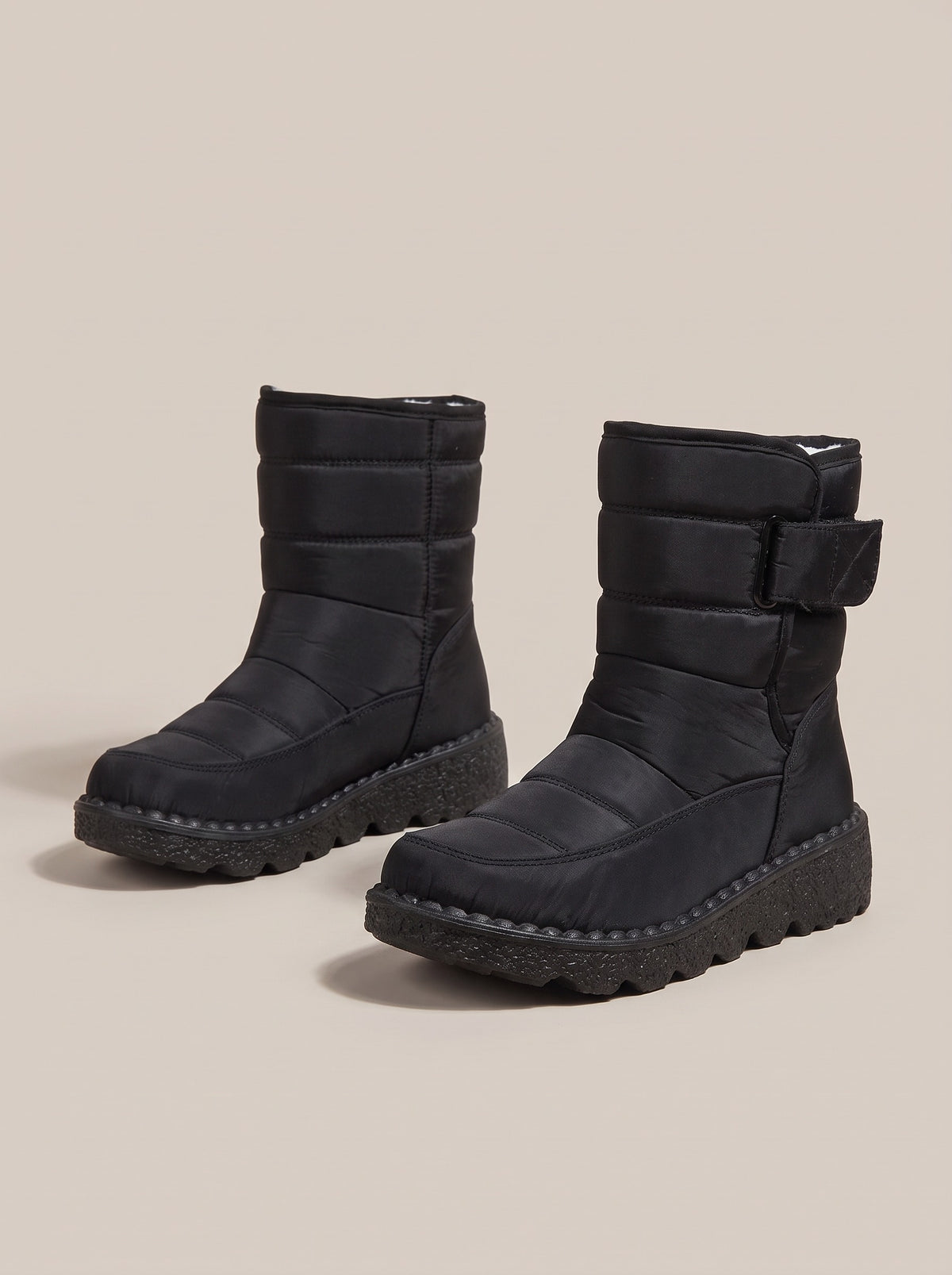 ZOEY Quilted Waterproof Snow Boots in black, front